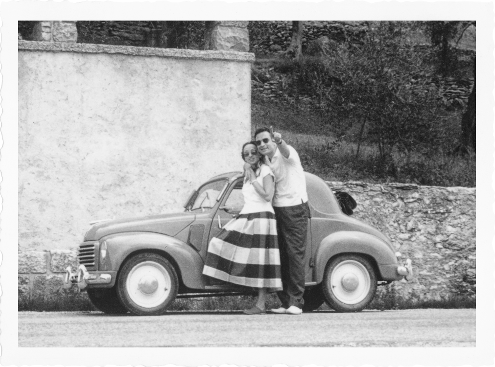 couple in front of car